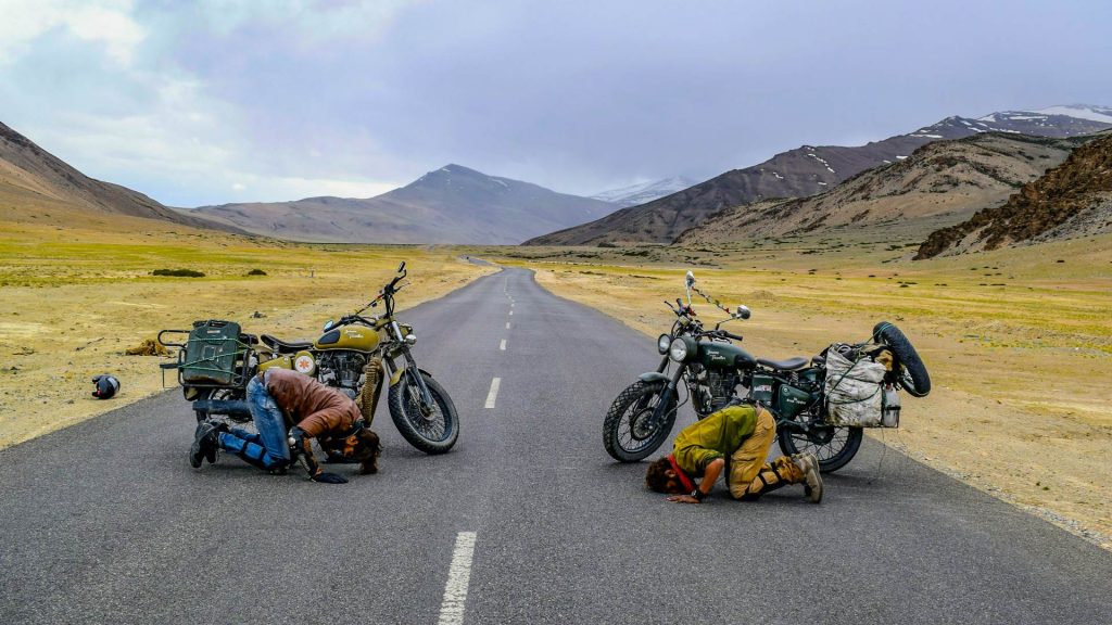two riders with their motorcycle in Ladakh, Himalayas